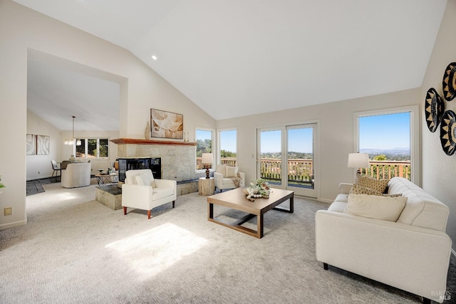 carpeted living room featuring high vaulted ceiling