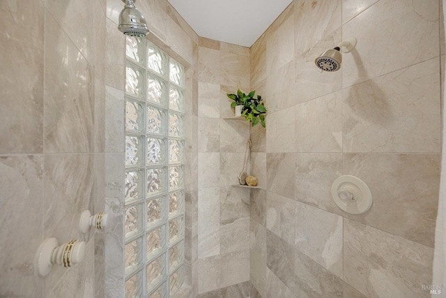 bathroom with a tile shower