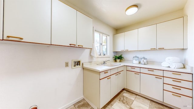 kitchen with sink and white cabinets