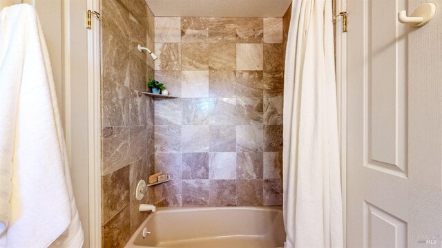 bathroom featuring shower / bath combo with shower curtain