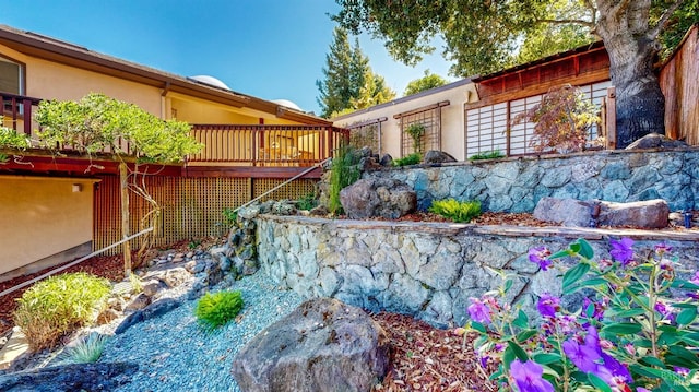 view of yard featuring a wooden deck