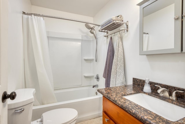 full bathroom with vanity, shower / bath combo, and toilet