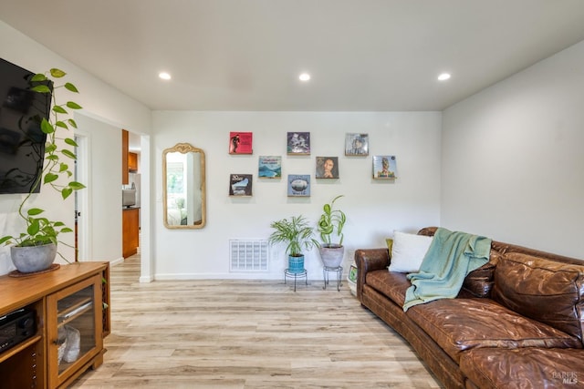 living room with light hardwood / wood-style flooring