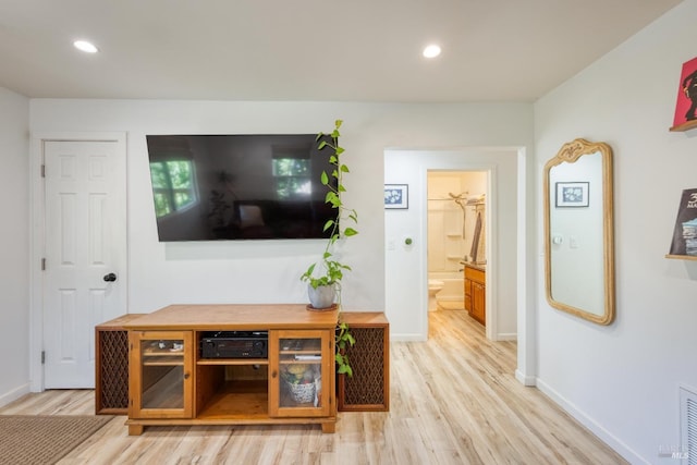 unfurnished living room featuring light wood-type flooring