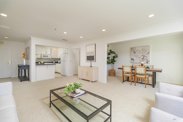 carpeted living room with crown molding