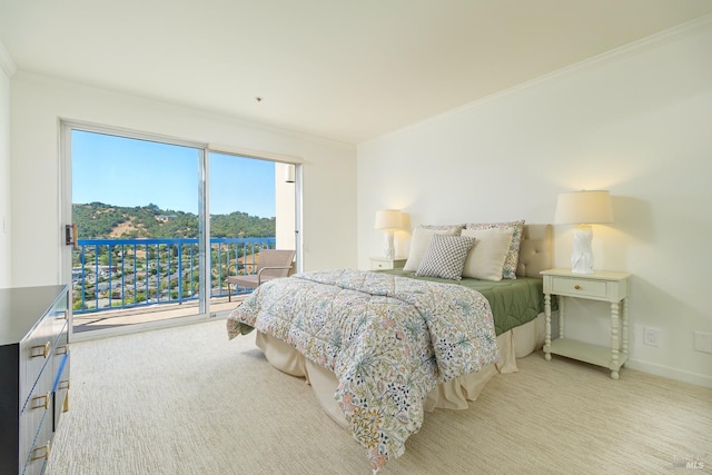 bedroom featuring light colored carpet and access to exterior