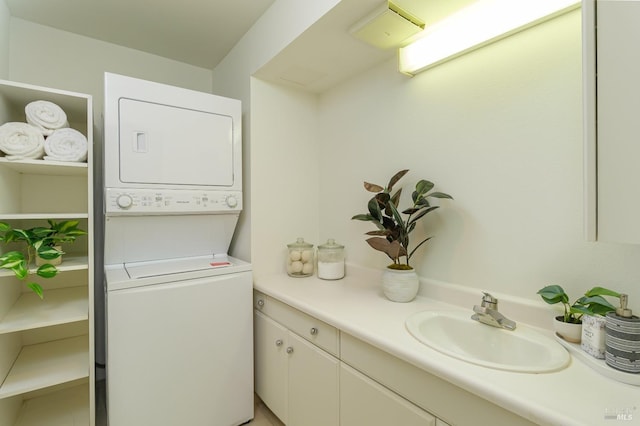 laundry area with stacked washer / dryer and sink