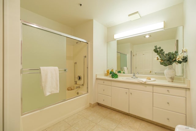 bathroom with vanity and combined bath / shower with glass door