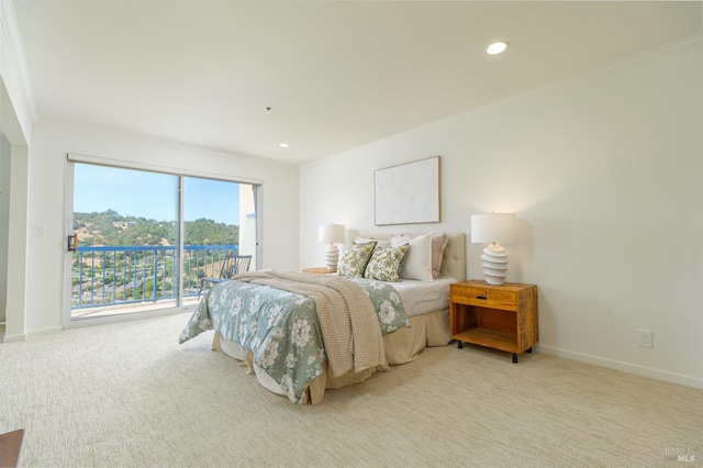 bedroom featuring crown molding, light carpet, and access to outside