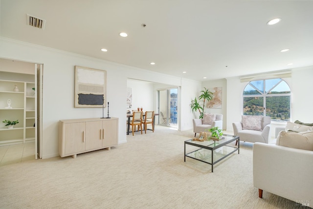 living room with crown molding and light colored carpet