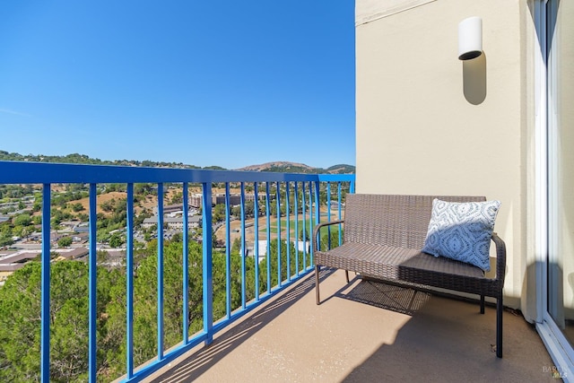 balcony with a water and mountain view