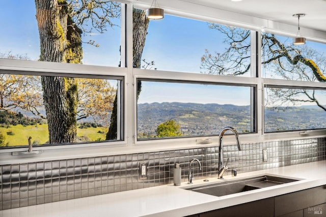 room details with a mountain view, pendant lighting, and sink