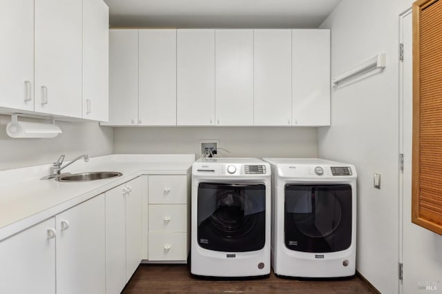 laundry room with separate washer and dryer, cabinets, sink, and dark hardwood / wood-style floors