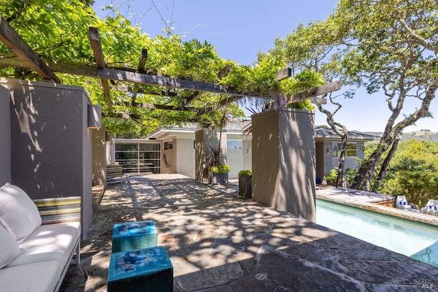 view of patio / terrace with a fenced in pool