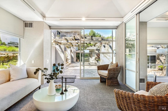 carpeted living room with lofted ceiling