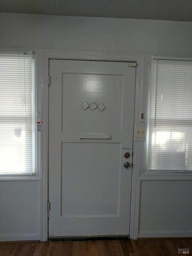 doorway featuring wood finished floors
