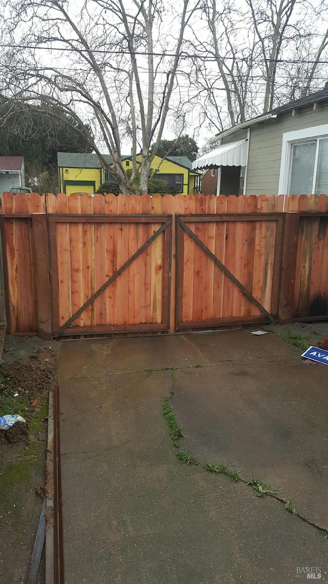 view of gate with fence