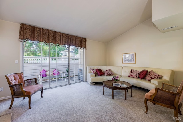 living room featuring lofted ceiling and light colored carpet