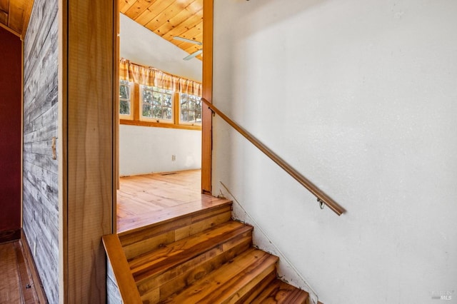 stairway with lofted ceiling and wood ceiling