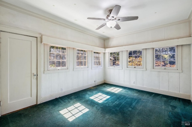 unfurnished sunroom featuring ceiling fan