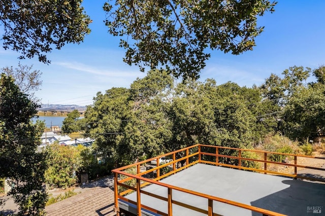 wooden terrace with a water view