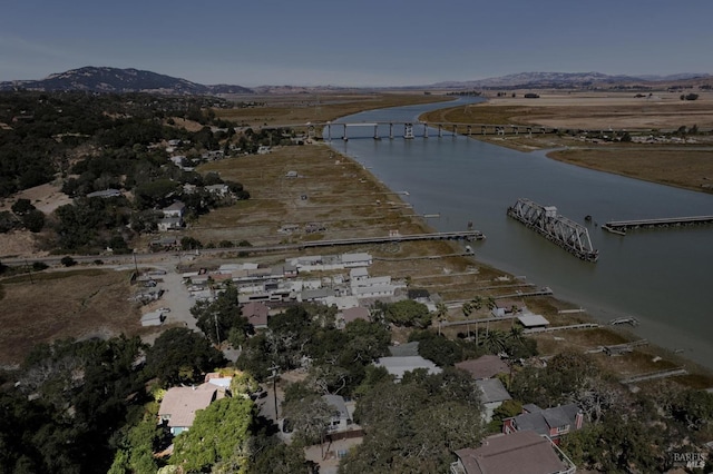 bird's eye view featuring a water and mountain view