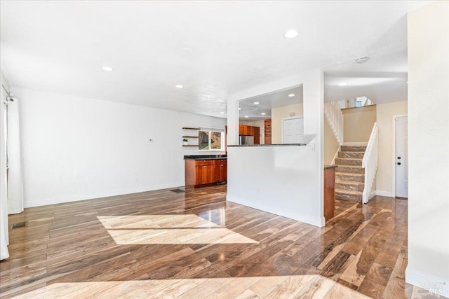 unfurnished living room featuring hardwood / wood-style floors