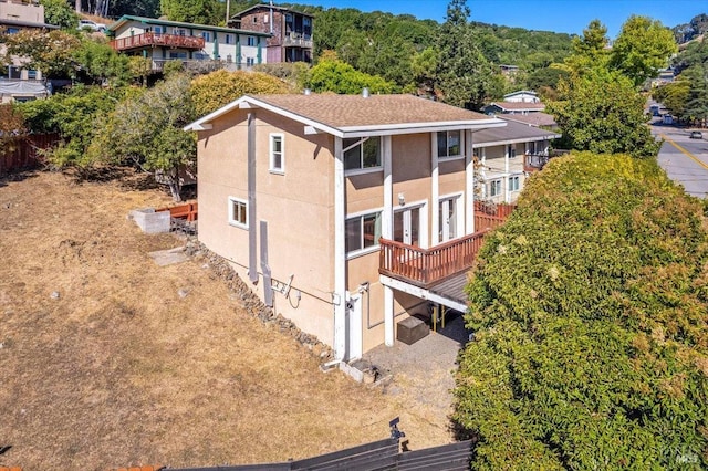 exterior space featuring a wooden deck