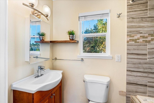 bathroom featuring vanity and toilet