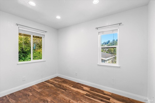 unfurnished room featuring dark hardwood / wood-style floors