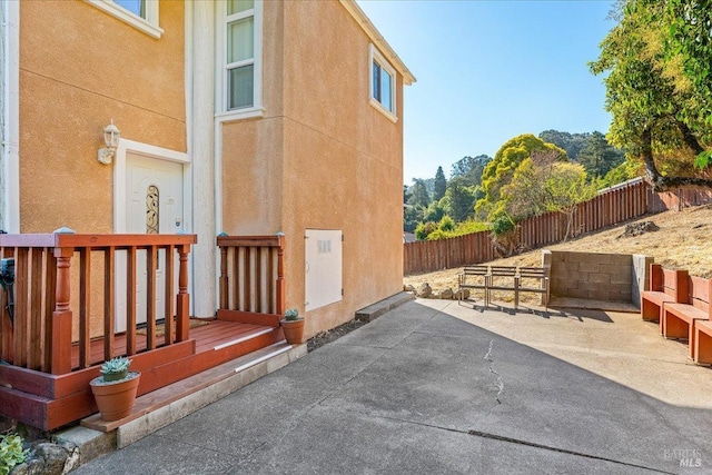 view of property exterior featuring a patio area