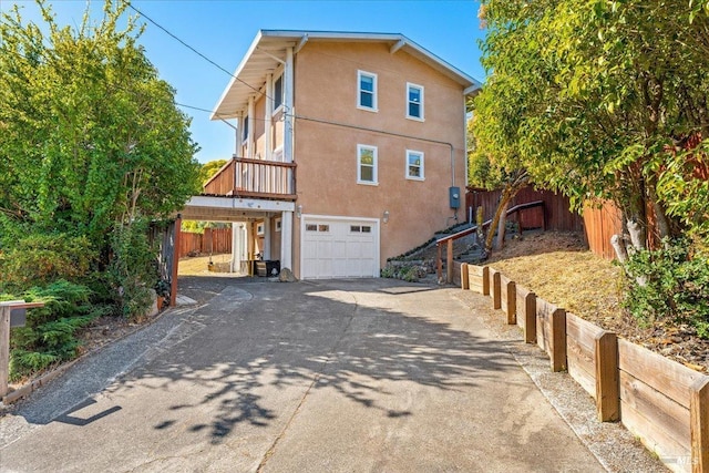 back of property featuring a garage