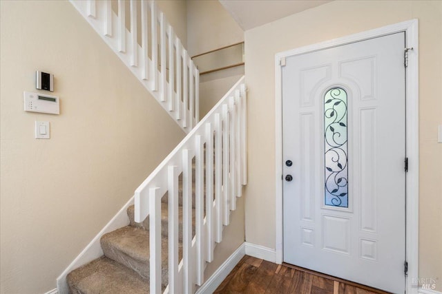 foyer with dark hardwood / wood-style floors