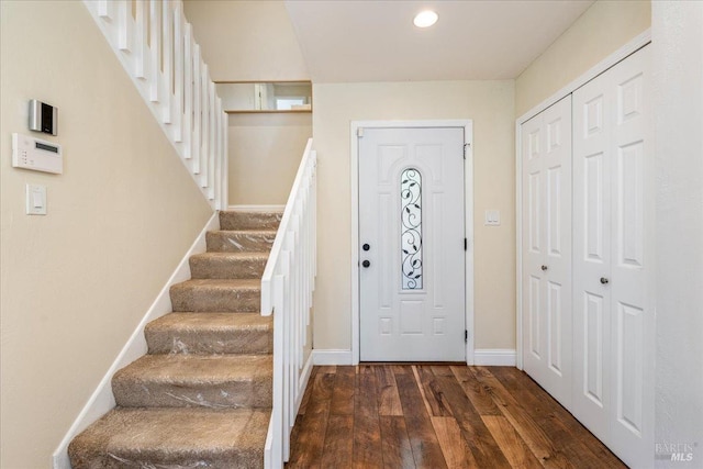 entryway with dark hardwood / wood-style floors