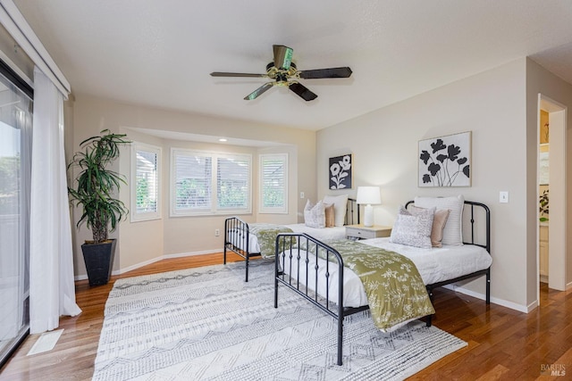 bedroom featuring wood-type flooring and ceiling fan