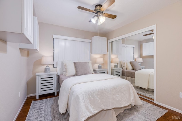 bedroom featuring dark wood-type flooring, ceiling fan, and a closet