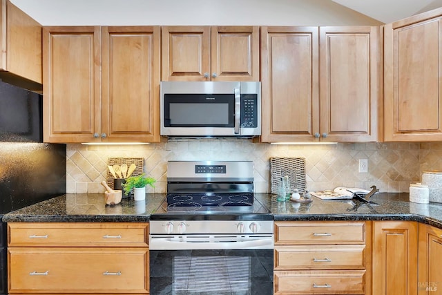 kitchen featuring stainless steel appliances and decorative backsplash