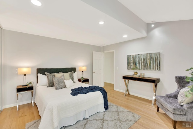 bedroom with hardwood / wood-style flooring