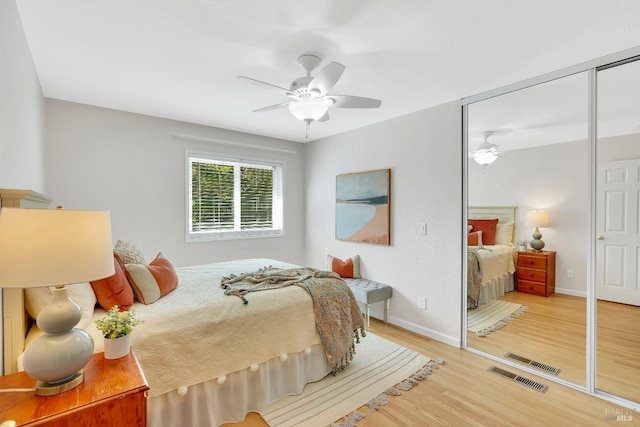 bedroom featuring a closet, ceiling fan, and hardwood / wood-style flooring