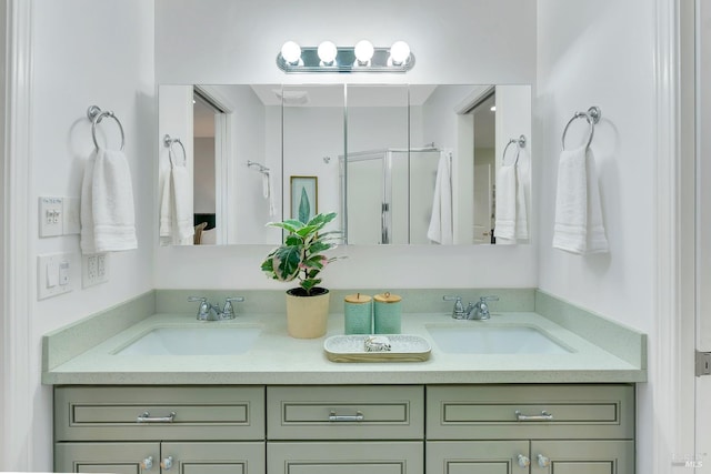 bathroom featuring walk in shower and vanity