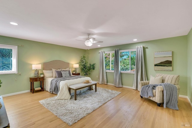 bedroom with light wood-type flooring and ceiling fan