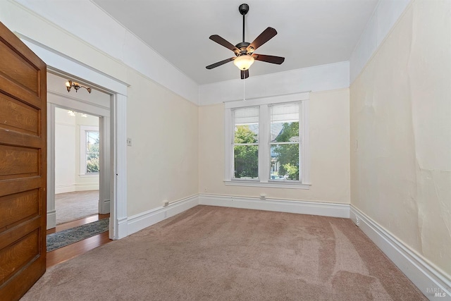 carpeted empty room with ceiling fan