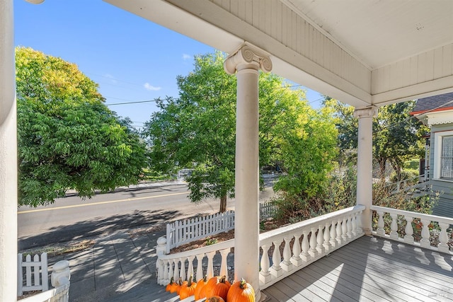 wooden terrace featuring covered porch