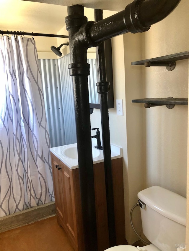 bathroom featuring ceiling fan, vanity, and toilet