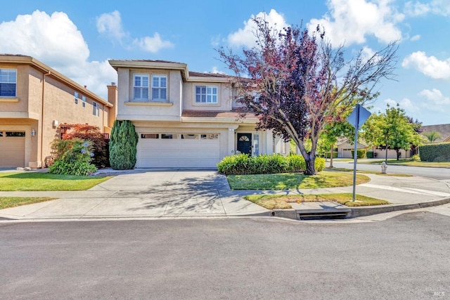 view of front of house with a garage and a front yard