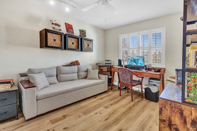 office area with rail lighting, ceiling fan, and light hardwood / wood-style flooring