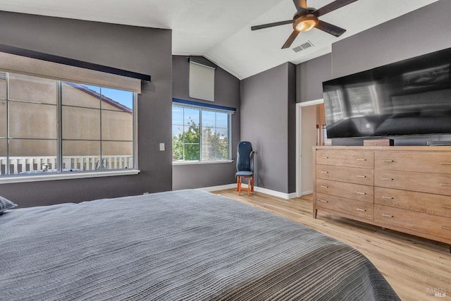 bedroom with lofted ceiling, light hardwood / wood-style flooring, and ceiling fan