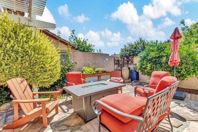 view of patio featuring a fire pit