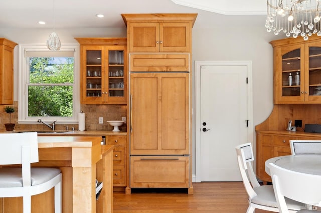 114 Van Tassel Ct, San Anselmo, CA 94960 - kitchen with decorative backsplash, light wood-style flooring, glass insert cabinets, paneled built in fridge, and light countertops