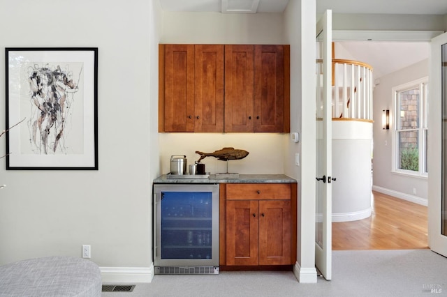 114 Van Tassel Ct, San Anselmo, CA 94960 - bar featuring visible vents, light carpet, baseboards, bar, and beverage cooler